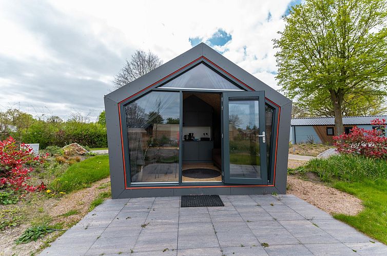 Solo Retreat 4 in Biddinghuizen bietet ein modernes Ferienhaus mit grosser Veranda, umgeben von der Natur Ost-Flevolands.