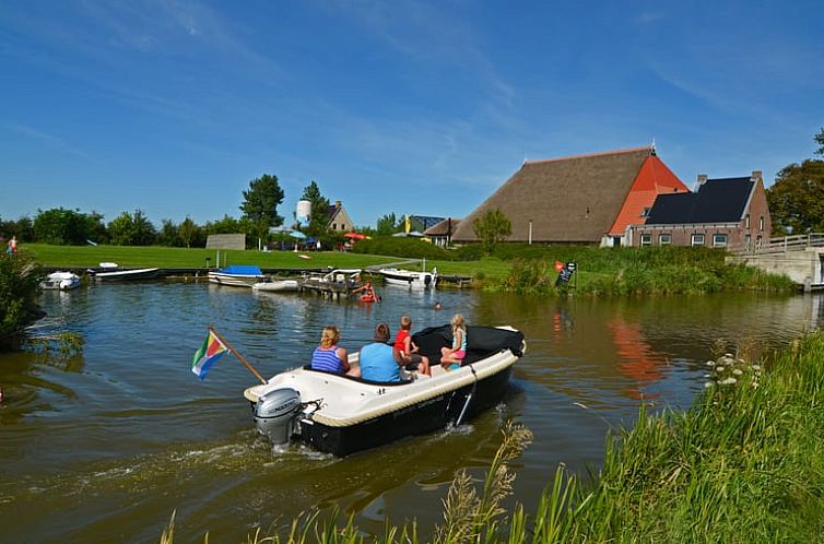 Cottage in Sint Annaparochie, Friesland, offers picturesque views of the Frisian countryside with a boat ride on the river.