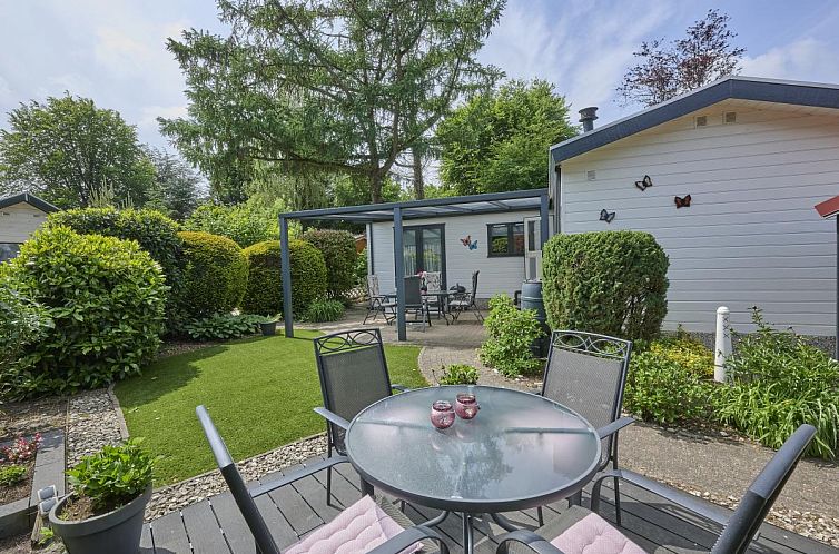 Enjoy the serene garden and terrace at vacation home Kerkuil in Hulshorst, Veluwe, Gelderland.