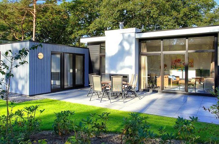 Enjoy the modern L-Cube 6 vacation home in Otterlo, Veluwe, with spacious terrace and green surroundings in Gelderland.