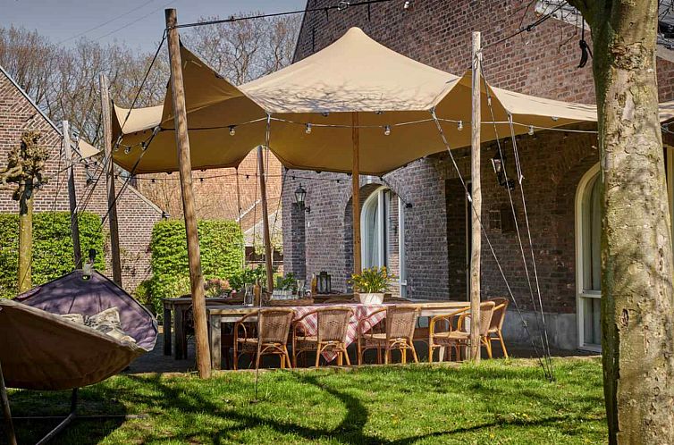 Enjoy the spacious veranda at vacation home L275 in Baarlo, North Limburg.