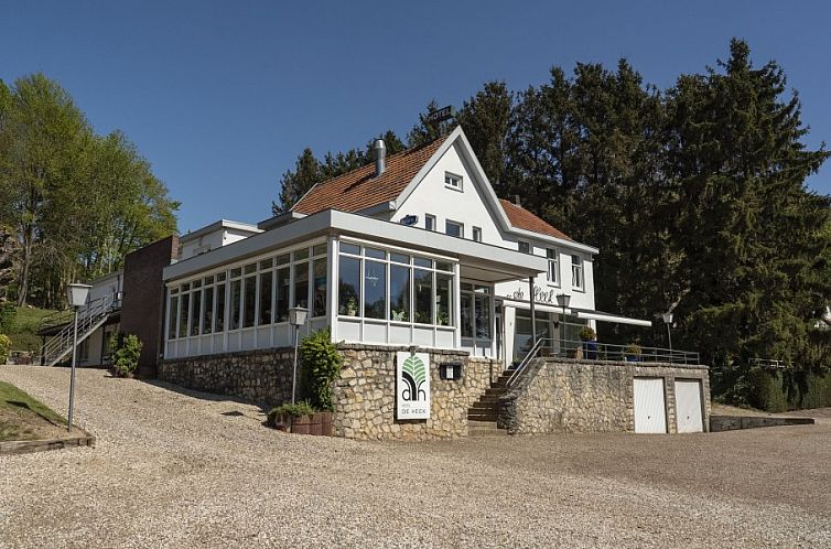 The Heek bed and breakfast in Valkenburg, South Limburg with charming stone facade and green surroundings.