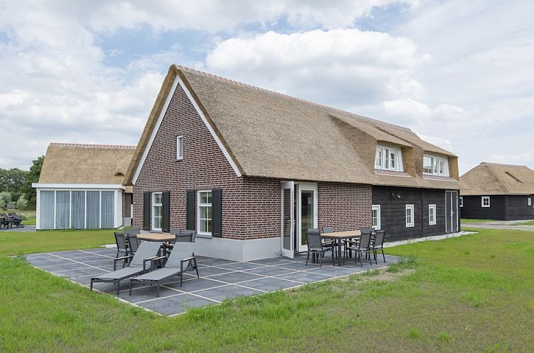 Cozy Family Villa 11 in Someren, De Peel, North Brabant with spacious terrace and green surroundings, ideal vacation home for relaxation.