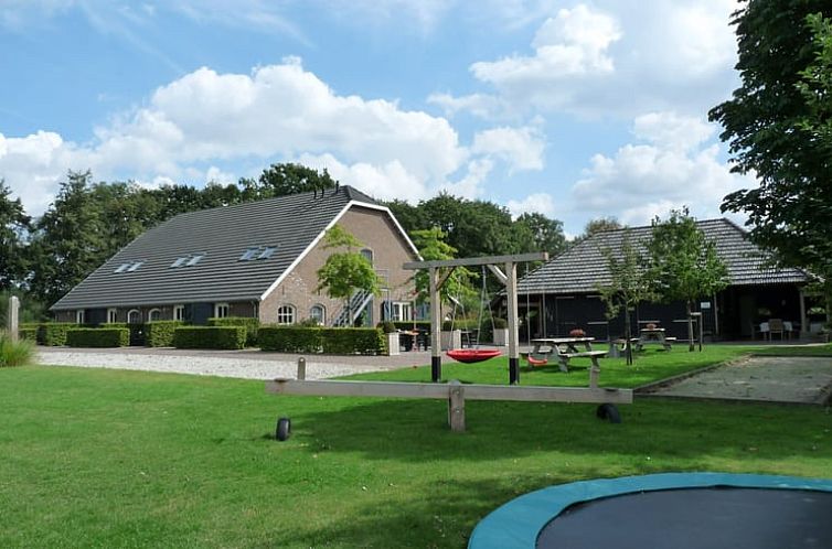 Spacious garden with play equipment at Holiday home in Helenaveen, Heart of Brabant, perfect for families.