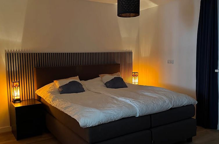 Comfortable bedroom in Holiday home in Haps, northeast Brabant, with atmospheric lighting.