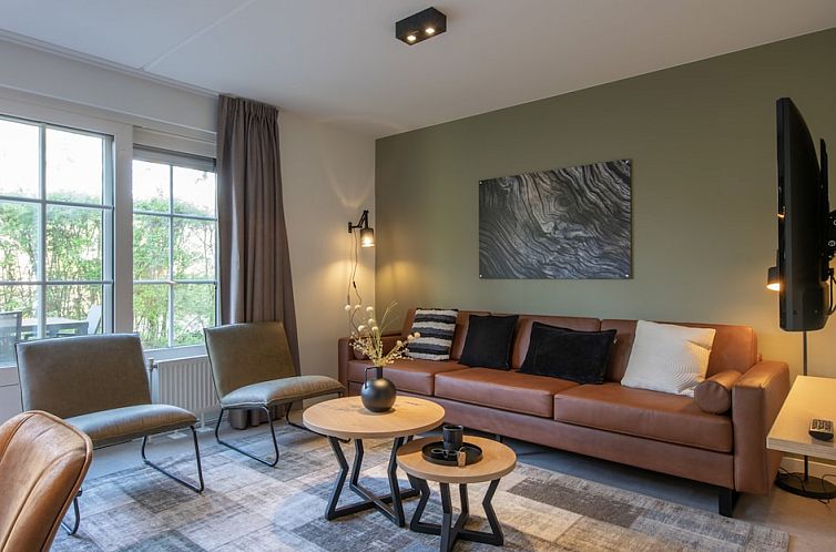 Stijlvolle woonkamer van KD Comfort Plus bungalow in Oosterhout, Noord Brabant, met comfortabele zitruimte en moderne inrichting.