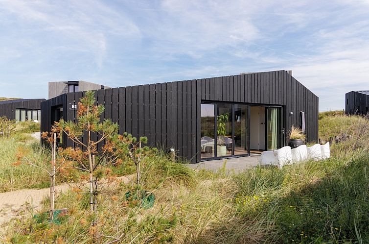 Kennemer Lodge Special 4, een modern vakantiehuis in Zandvoort aan de Noordzeekust, omgeven door duinen en natuurlijke schoonheid.
