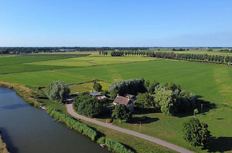 View of green fields from Cottage in Hensbroek, vacation home in North Holland.