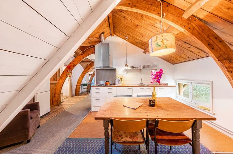 Cozy indoor area of Holiday Home in Diepenveen, located in Salland, Overijssel, with wooden beams and a spacious kitchen.