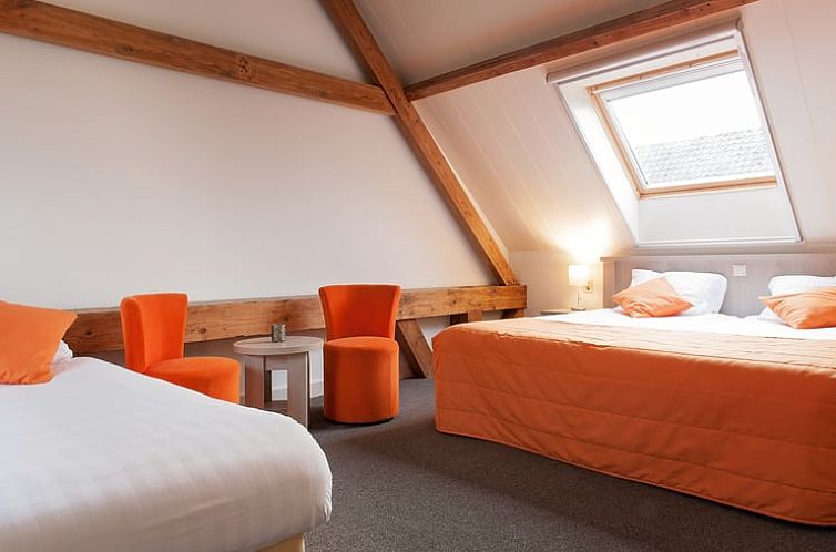 Cozy bedroom in Holiday home in Vreeland, Utrecht north. Comfortable beds and rustic beams for a cozy atmosphere.