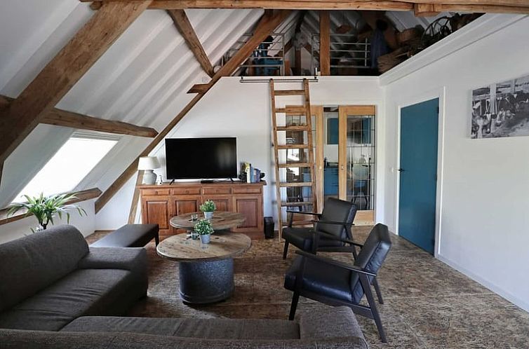 Cozy living room in Holiday Home in Achterveld, Utrecht Hill Ridge, with wooden beams and comfortable seating area.