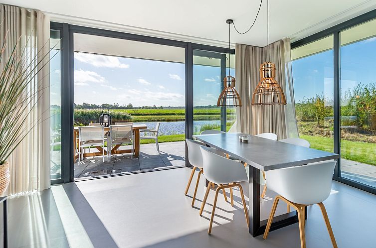 Dining area overlooking terrace at Waterline 20 | De Groote Duynen, Kamperland, North Beveland.