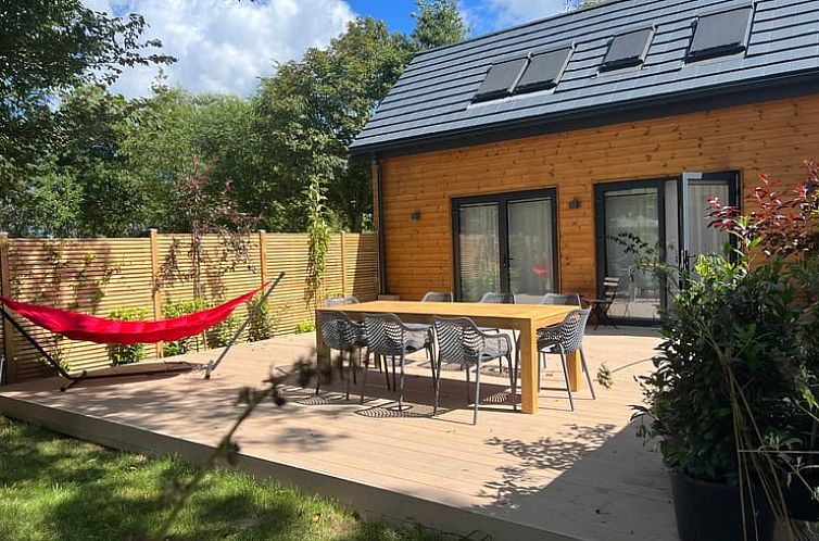 Spacious terrace at Holiday Home in Kamperland, North Beveland, perfect for outdoor dining and relaxation.