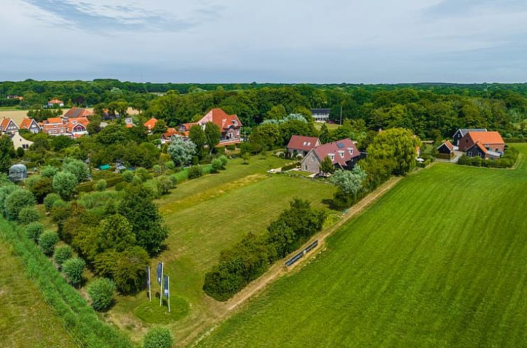 Aerial photo of Holiday home in Oostkapelle surrounded by greenery on Walcheren, Zeeland.