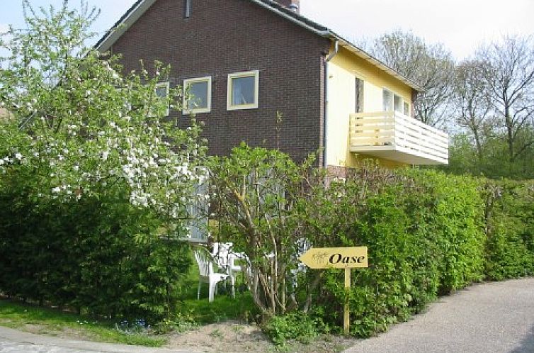 Apartments OASE in Cadzand-bad, surrounded by green nature and an inviting balcony in Zeeuws-Vlaanderen, Zeeland.
