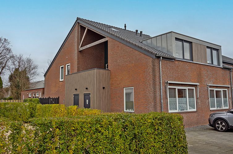 ZH416 vacation home in Ouddorp, Goeree-Overflakkee, featuring modern architecture and green surroundings.