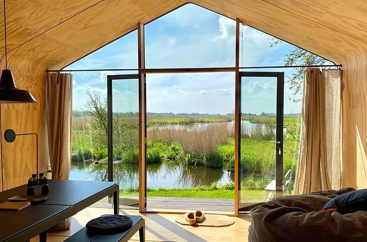 Geniessen Sie den Panoramablick vom Huisje in Noorden, einem Ferienhaus im Gruenen Herzen von Suedholland, mit ruhiger Natur.