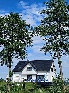 Appartement Appartement Gemütliches Ferienhaus mit Garten und Seeblick, Kolczewo, Pologne Nord, Pologne